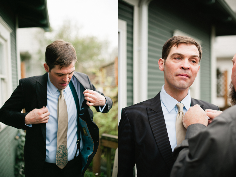 groom putting on jacket
