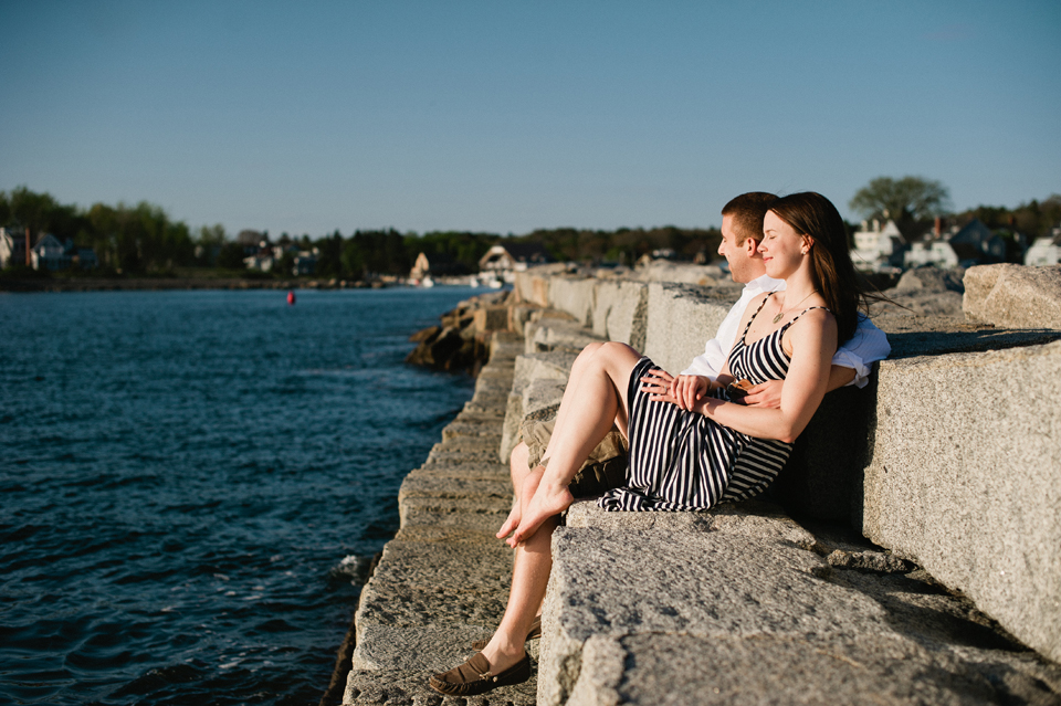 couple lounging on breakwater