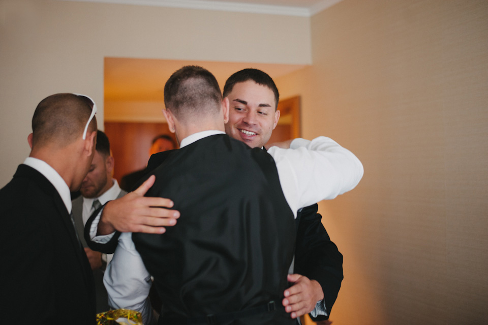 groom hugging best man