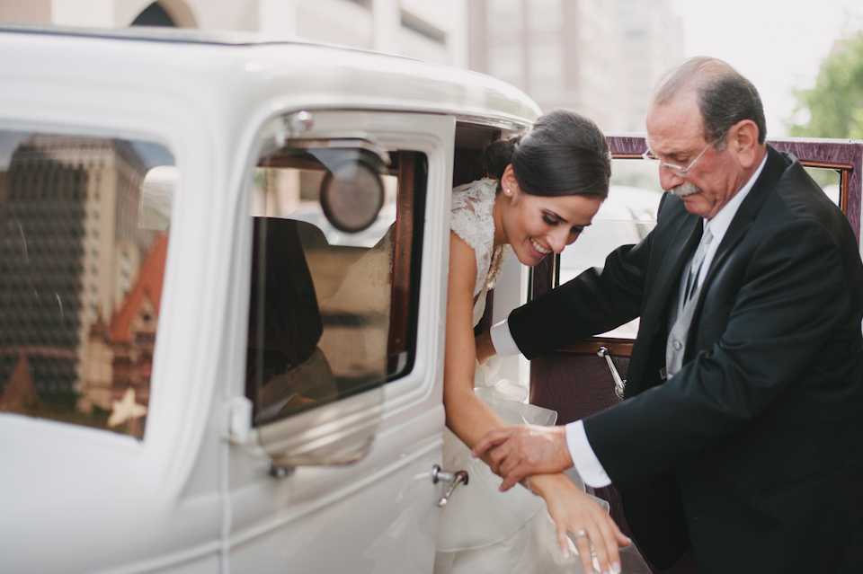 bride getting out of old car