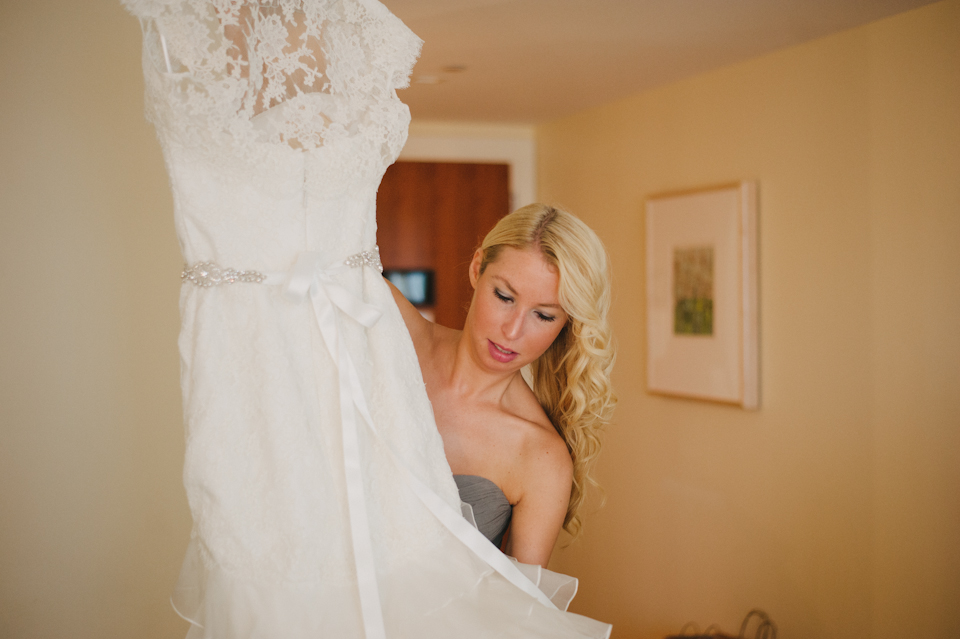bridesmaid holding dress