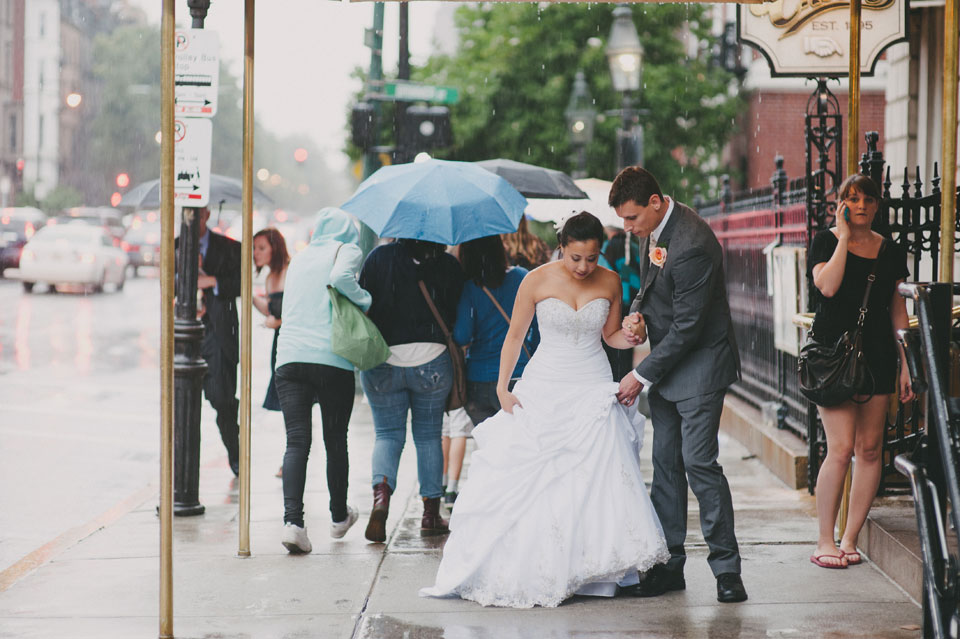 back bay bride and groom portraits pouring rain